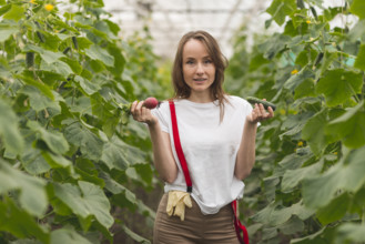 Woman taking care plants greenhouse 2