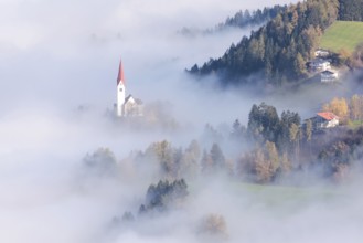 The Church of St. Peter in the fog, Weerberg, Tyrol, Austria