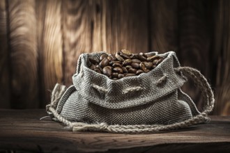 Vintage vith coffee beans sack on old wood desk and wooden background1