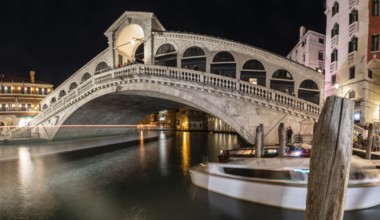 Rialto Bridge over Grand Canal, night shot, light trails with long exposure, Venice, Italy