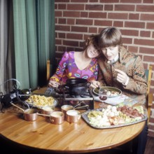 Fondue. A dish that had its breakthrough in the 60s and 70s. A fondue pot with hot oil stands in