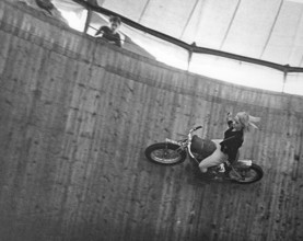 Wall of death 1967. The wall of death, motordrome, velodrome or well of death is a carnival
