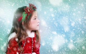 Cute girl wearing christmas outfit on snowy background, Toronto, Canada