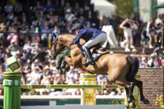Daniel Deusser of Germany and riding Killer Queen VDM compete in the first round of the 1.60m CPKC