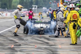 INDYCAR Series driver, RINUS VEEKAY (21) of Hoofddorp, Netherlands, brings his car in for service
