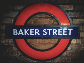 The iconic round sign of Baker Street Underground Station on a brick wall Baker Street Underground