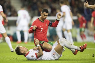 Football match, captain Cristiano RONALDO CR7 Portugal kneeling on the stomach and partly on the