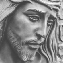 Statue of the face of jesus with a crown of thorns. Close-up. Ideal for concepts or events like
