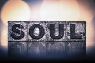 The word SOUL written in vintage ink stained letterpress type