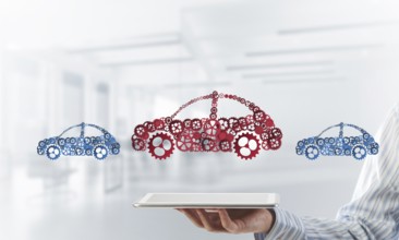 Car icon made of gears and cogwheels on white office background. Mixed media