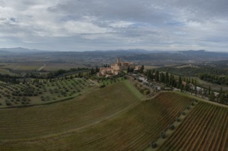 Montalcino, Italy, 16 November, 2023: aerial view of the Poggio alle Mura Castle and Villa Banfi