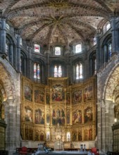 Avila, Spain, 8 April, 2024: view of the central nave and altar with gilded altar piece in the