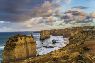 Travel to Australia. Pink dawn clouds over the rocks Twelve Apostles. Early morning on the ocean