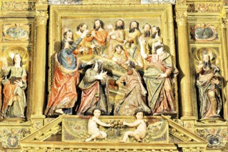 Detail of a baroque relief with religious figures and golden decorations, Iglesia de Santa Maria de