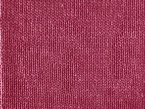 Viva Magenta color knitted Jersey as textile background. Knitted Red Magenta texture. Color of the