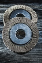 Used grinding wheels on vintage wooden board
