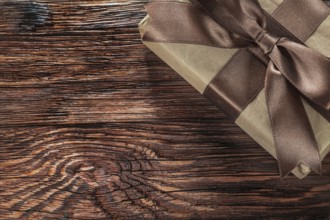 Brown gift box on vintage wooden board