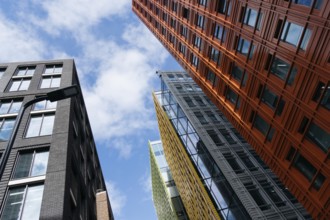 London, UK, August 27, 2023: Low angle view of modern and colorful apartment and office buildings