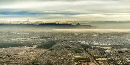 Aerial view of the of the mountainous terrain in the outskirts of the city of Cape Town, South