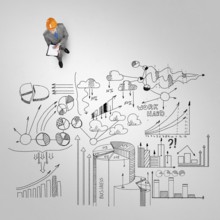 Top view of engineer man with folder and plan sketches on floor