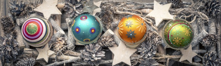 An image of a christmas decoration banner with colored christmas glass balls