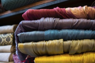 Pile of bright Multi-colored pieces of fabric in a bazaar