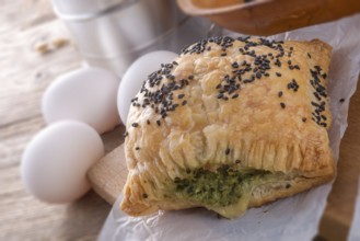 Puff pastry with spinach filling and black cumin