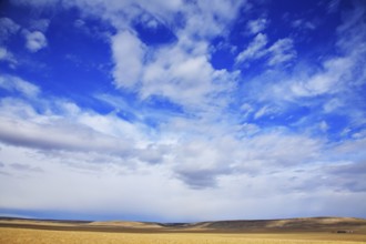 The high dark blue sky with freakish clouds above Yellowstone national park