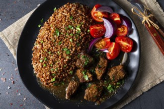 Buckwheat oats baked in the oven with beef goulash