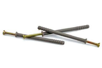 Three dowel screws with yellow nails and gray plastic plugs isolated on white background