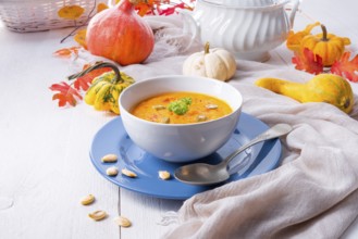 Healthy pumpkin soup with ginger carrots and coconut milk