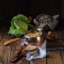 Young and fresh cabbage cooked with bacon cubes