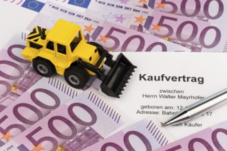 The purchase contract for a new excavator. With euro money and biros Austria