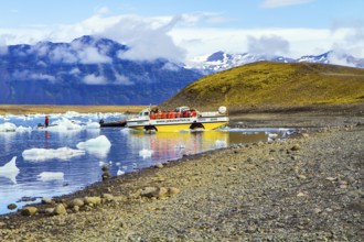 ICELAND, SCAFTAFETL PARK, ICE LAGOON JOKULSAURLOUN - July 10, 2014: Yellow boat for tourists. The