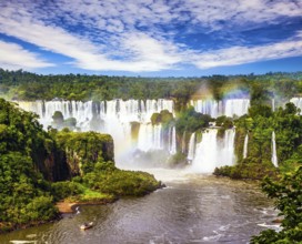 Concept of active and extreme tourism. Incredible exotic waterfalls of Iguazu in South America, on