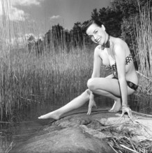 In the 1950s. Beutiful Iris Johansson on a summer day wearing men's neckties as a bikini-like