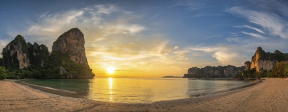 Tropical islands sunset view with ocean sea water and sand beach at Railay Beach, Krabi Thailand