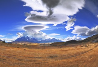 The Chile National Park Torres del Paine. Incredible shaped clouds formed by glaciers glisten in