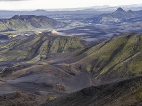View from Mount Sveinstindur, volcanic landscape, moss-covered hills, mountains, Icelandic
