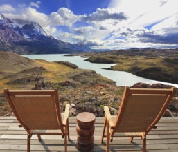 Wooden chairs in the Chilean national park Torres del Paine. Pleasant holiday