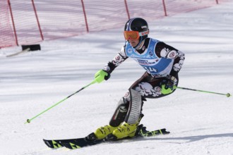 Mount skier Zhuravchenko Stepan Krasnodar Region skiing down. Russian Alpine Skiing Championship,