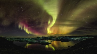 Northern lights aurora in Jokulsarlon glacial river lagoon