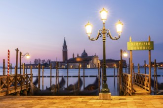 Dawn, Venetian gondolas with the church of San Giorgio Maggiore in the background, Venice, UNESCO