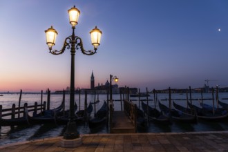 Dawn, Venetian gondolas with the church of San Giorgio Maggiore in the background, Venice, UNESCO