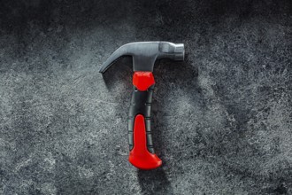 Black Little Claw Hammer On Dark Grey Background