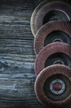 Rotary grinding discs on wooden board