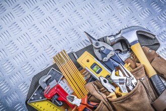 Tool belt with construction objects on corrugated metal pattern building concept