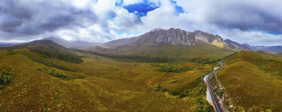 An aerial view of Gordon River Rd at the Sentinel range of mountains near Bitumen Bones Sculpture