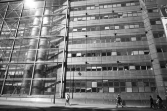Man and building in paris, france