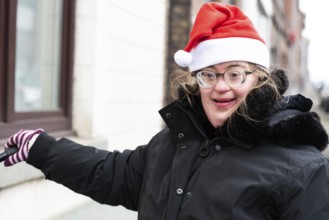 Happy 39 year old woman with Down Syndrome with a christmas cap, Tienen, Hakendover